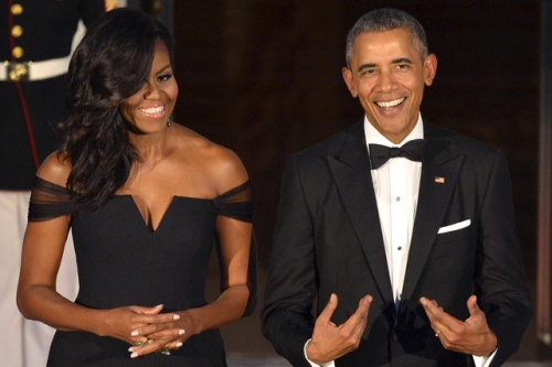 Vợ chồng ông Obama (Ảnh: AFP)