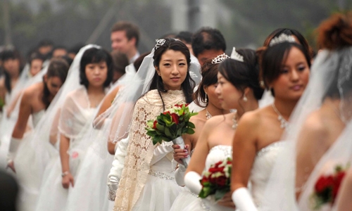 Một đám cưới tập thể ở Bắc Kinh vào năm 2013. Ảnh: CNN.